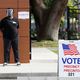 Deputy polling precinct worker Seandra Pinder waits for voters to cast their ballot in Florida’s primary election at Precinct 321 on August 18, 2020 in Tampa, Florida.